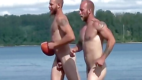 Sexy blond risk looks on the beach with a dildo